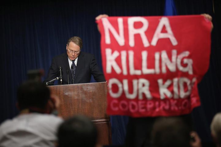 Photo: Protesters interrupt the NRA press conference:  http://huff.to/VaDtP6 
Photo Credit: Chip Somodevilla/Getty Images